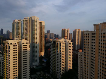 Modern buildings in city against sky