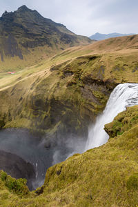 Scenic view of river flowing through rocks