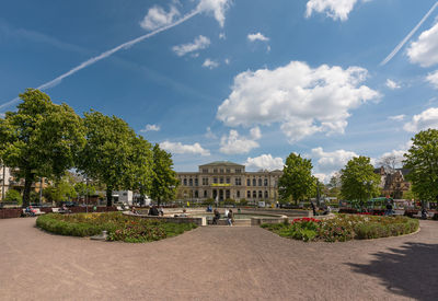 Trees and buildings against sky