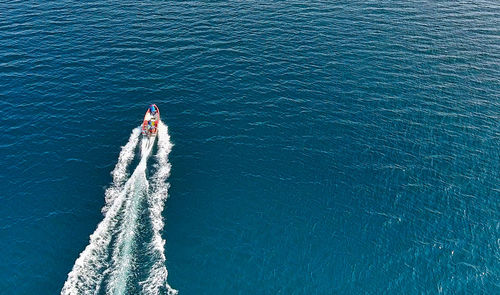 Aerial view of boat sailing in sea