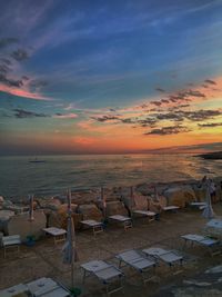 Scenic view of beach against sky during sunset