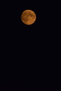 Low angle view of moon against sky at night