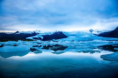 Scenic view of frozen lake against sky