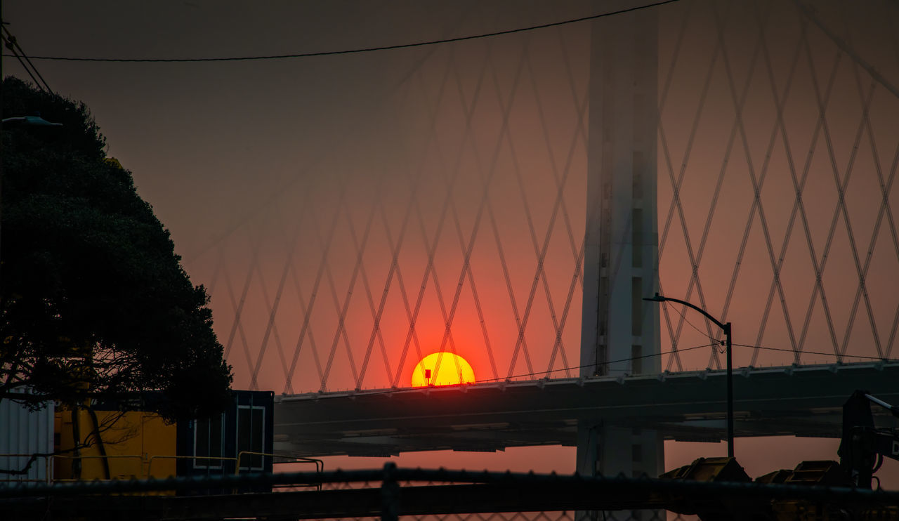 SILHOUETTE BRIDGE OVER ILLUMINATED ORANGE SKY