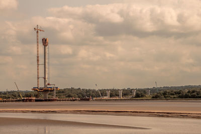 View of crane against sky