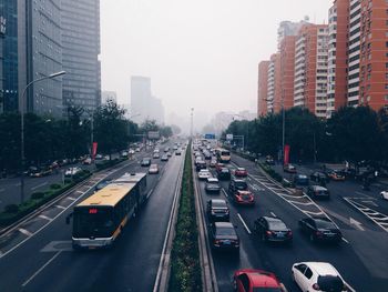 Busy city street between modern buildings