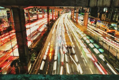 High angle view of light trails on road in city