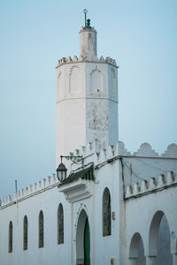 Low angle view of bell tower against sky