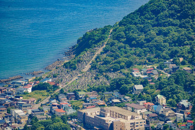 High angle view of townscape by sea