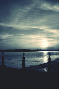 Silhouette of people at sunset