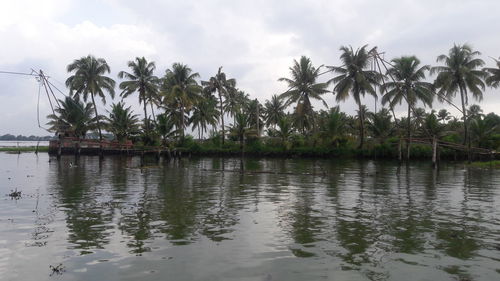 Scenic view of lake against cloudy sky