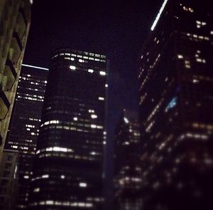 Low angle view of modern building at night