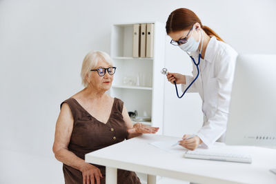 Woman looking at camera on table