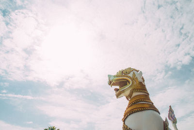 Low angle view of statue of temple against sky