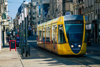 View of cars on street in city