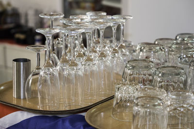 Close-up of wine glasses on table