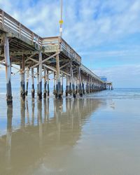 Pier on sea against sky