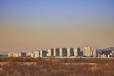 Panoramic view of buildings against sky during sunset