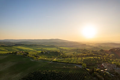 Scenic view of landscape against sky during sunset