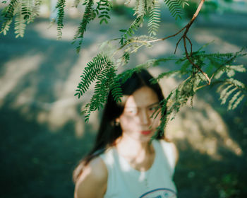 Portrait of woman against plants