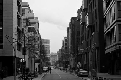 Vehicles on road along buildings