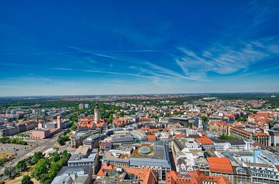 High angle shot of townscape against blue sky