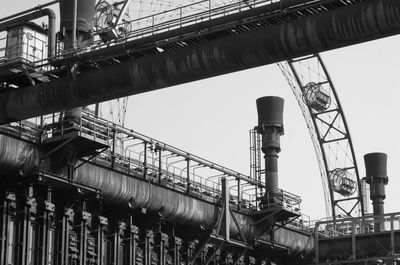 Low angle view of factory against clear sky