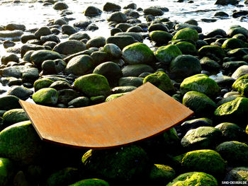 Close-up of pebbles in water