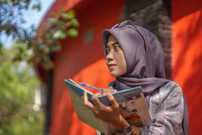 Young woman using mobile phone