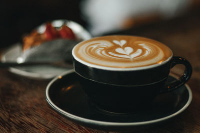 Close-up of cappuccino on table