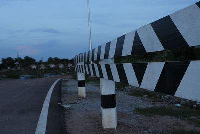 Zebra crossing on road against sky