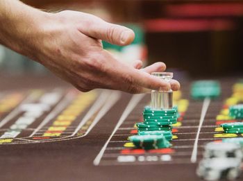 Cropped hand playing with gambling chips