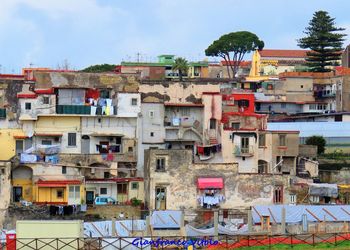 Houses against sky in city