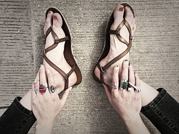 Low section of woman standing on tiled floor