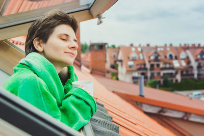 Happy boy looking away outdoors