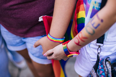 Close-up of couple holding hands