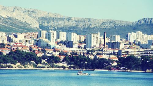 Calm sea with mountain range in background