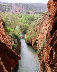 Scenic view of river passing through mountains