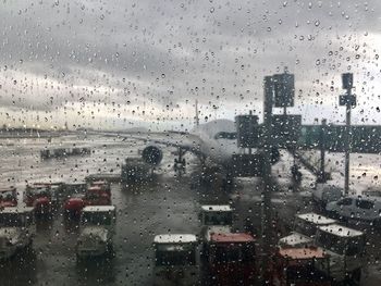 City seen through wet window during rainy season