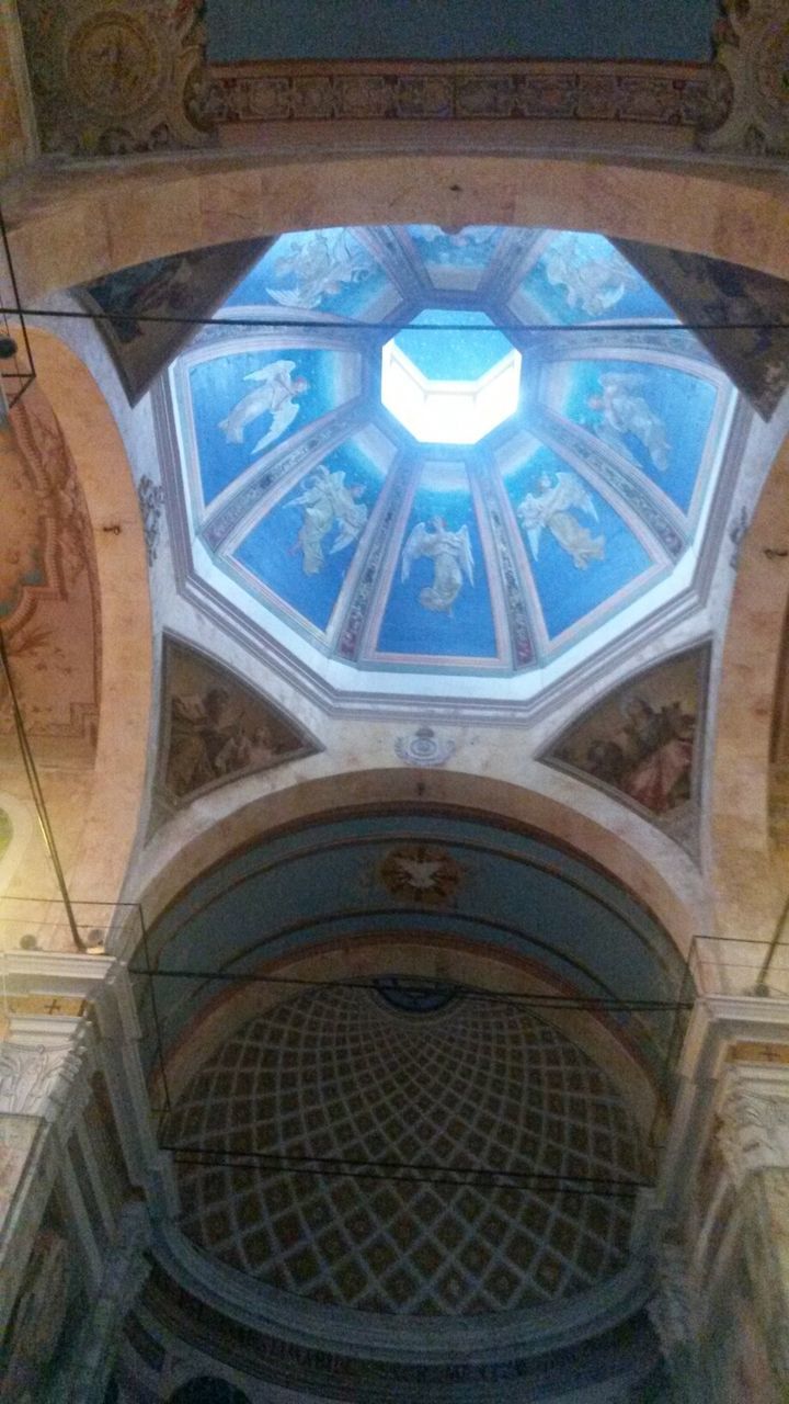 architecture, low angle view, built structure, building exterior, window, indoors, circle, arch, ceiling, glass - material, building, no people, pattern, church, geometric shape, blue, day, architectural feature, old, directly below