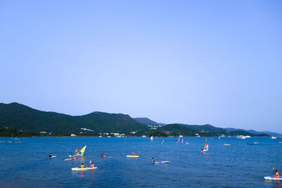 Boats sailing in sea