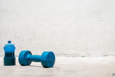 Close-up of dumbbells on wall