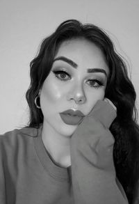 Portrait of a beautiful young woman over white background