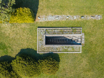 High angle view of information sign in lawn