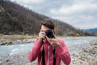 Portrait of man photographing