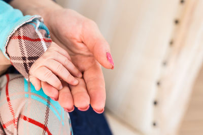 Close-up of woman holding hands