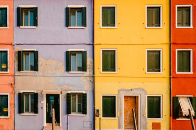 Facade of colorful houses in burano