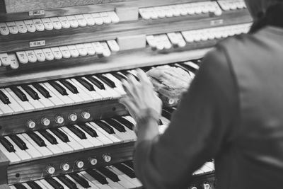 Cropped image of pianist playing piano