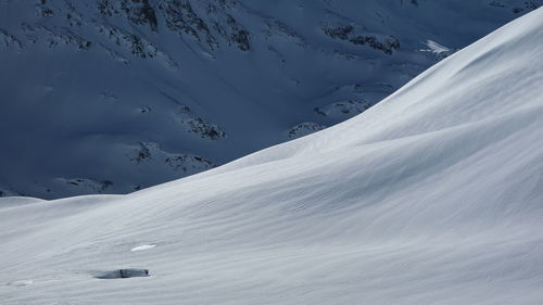 Scenic view of snow covered mountain against sky