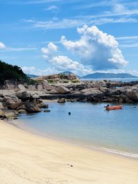 Scenic view of beach against sky